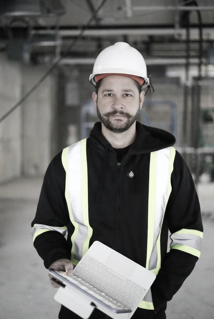 Hello Building foreman on a commercial site reviewing project drawings