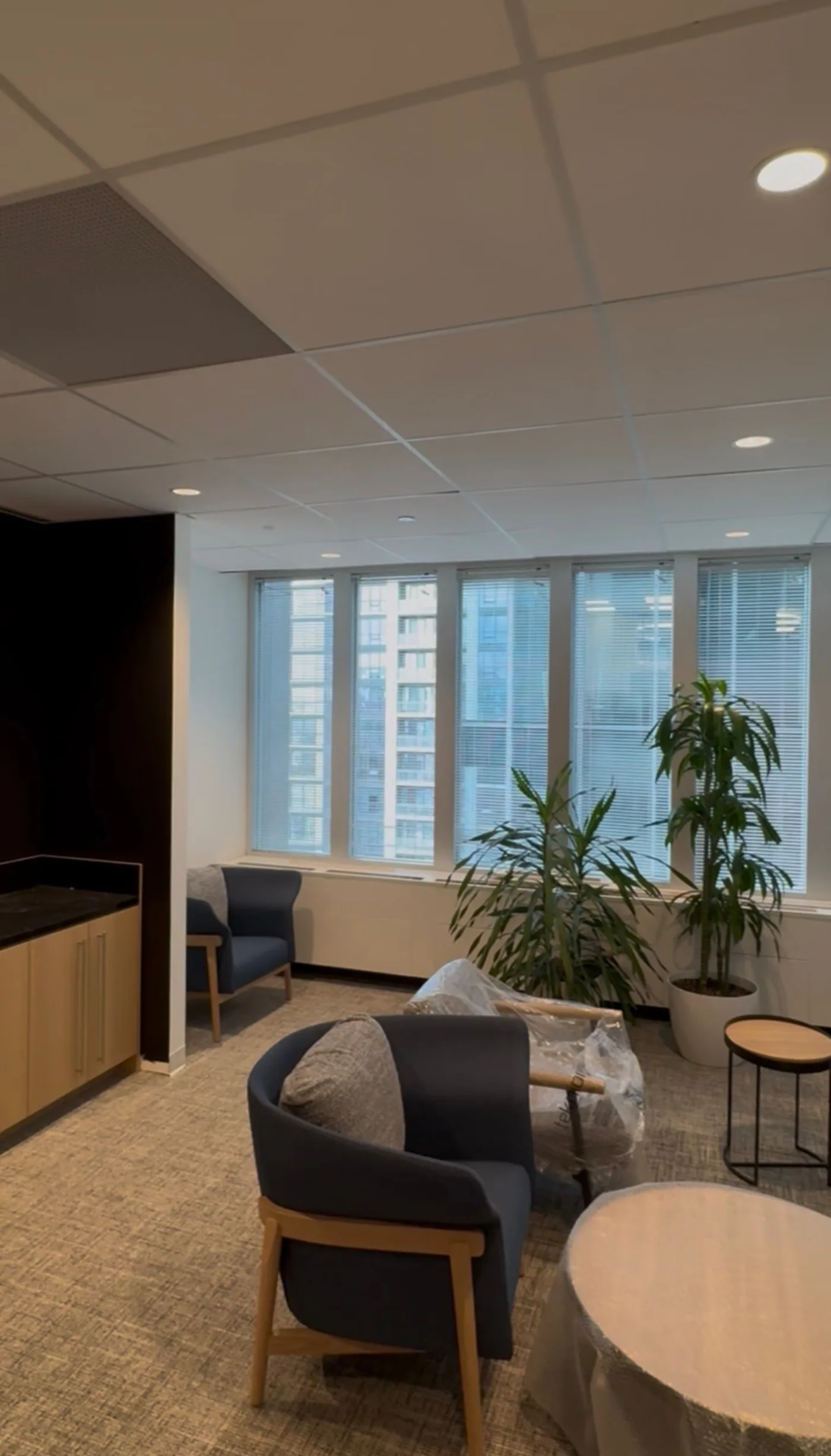 Reception and lounge area with finished T-bar ceiling and pot lights