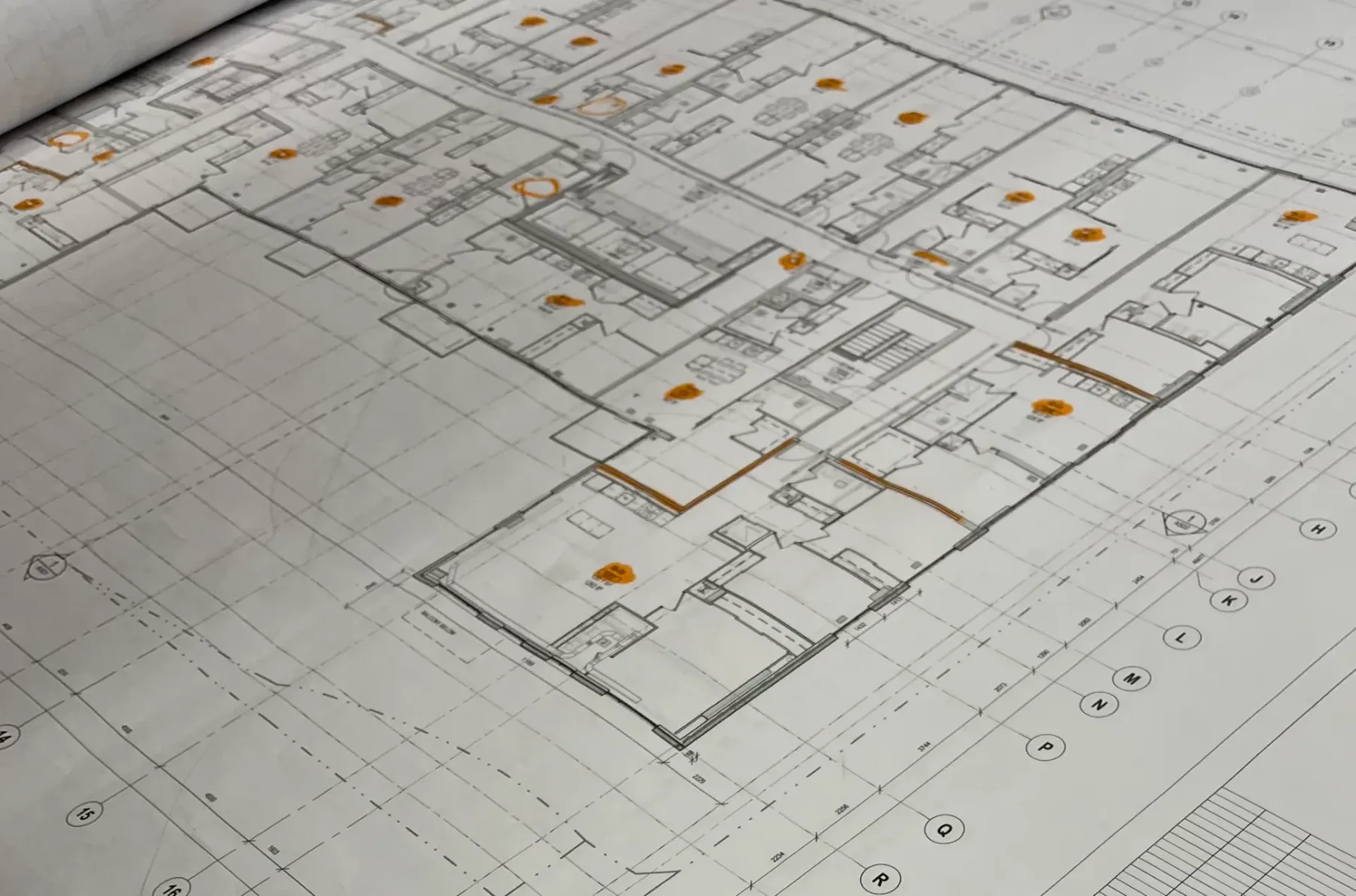 Marked-up commercial floor plans with highlighted scope for takeoff and layout